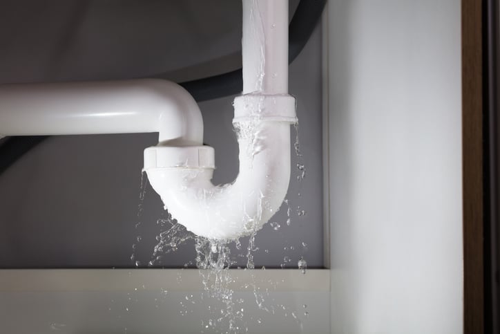 Professional plumber repairing kitchen sink in Butte County, CA