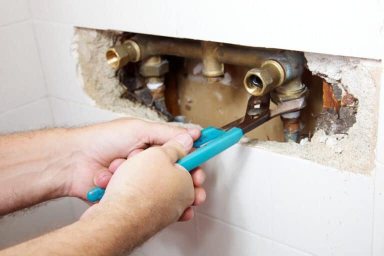 Plumber performing pipe repair in Biggs, CA home