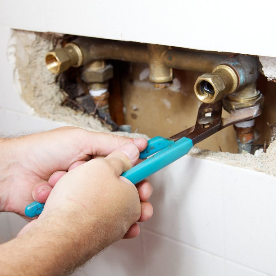 Plumber performing pipe repair in Biggs, CA home